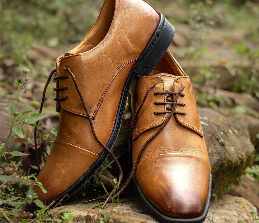 Tan leather cap-toe derby shoes