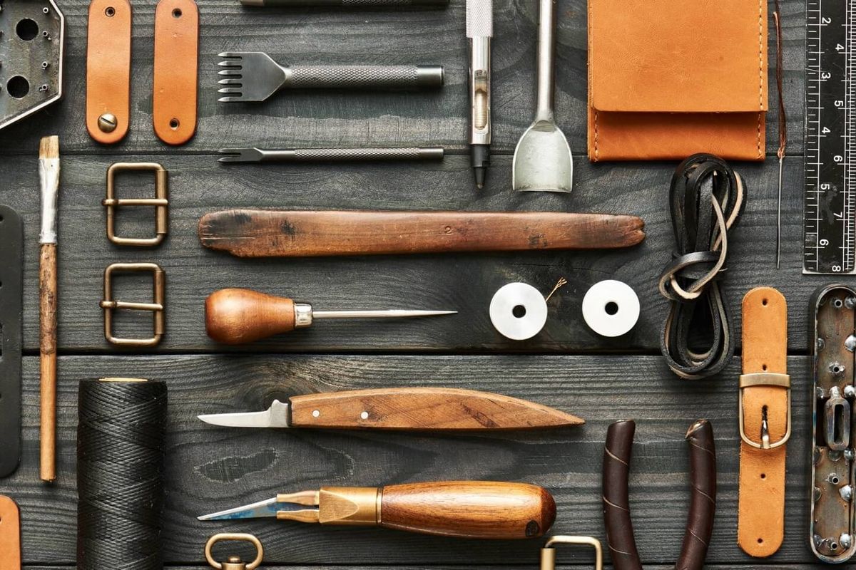 Leatherworking tools: awls, knives, punches and waxed thread